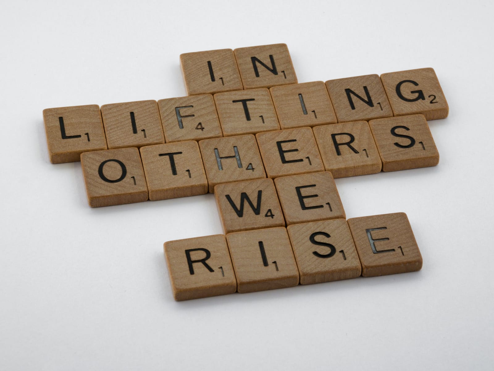 Scrabble game spelling: In Lifting Others We Rise