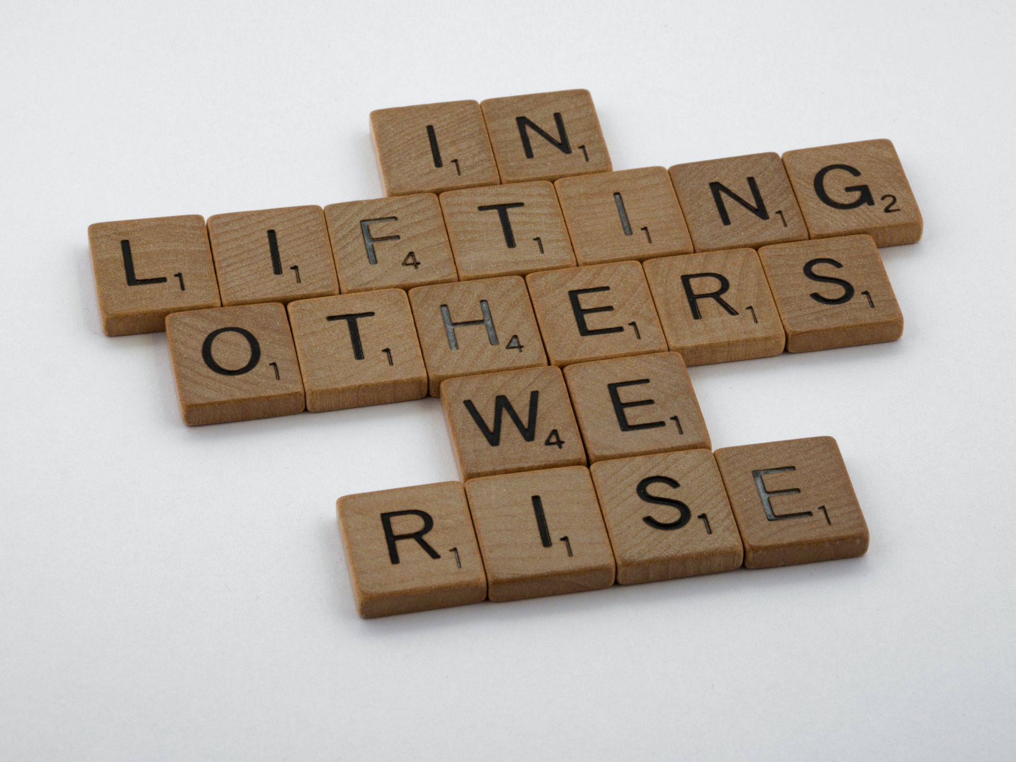 Scrabble game spelling: In Lifting Others We Rise