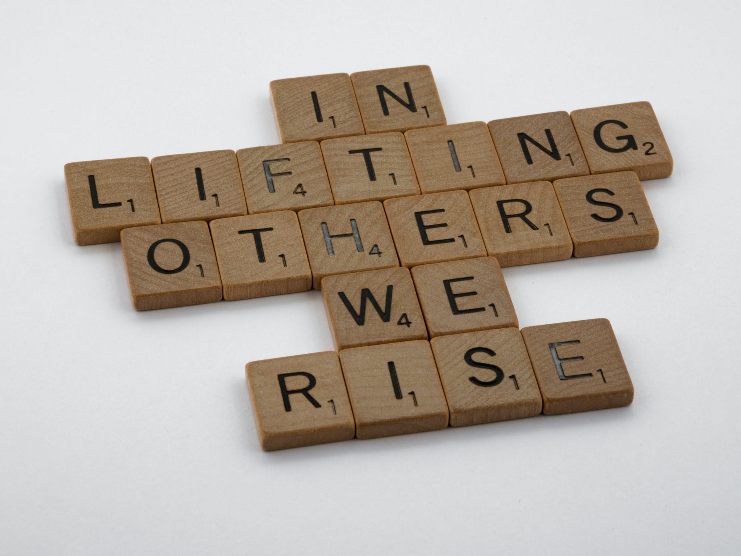 Scrabble game spelling: In Lifting Others We Rise