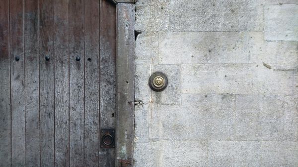 Old doorbell on wall