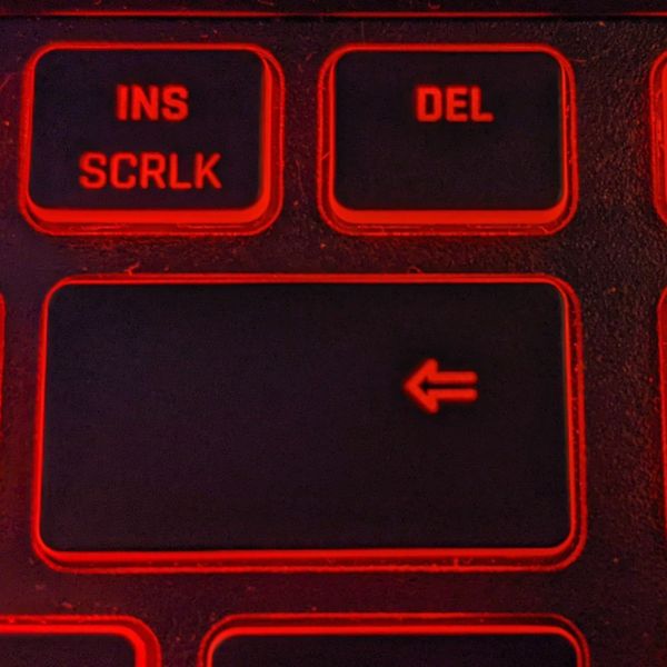 Delete key of a keyboard with red backlight