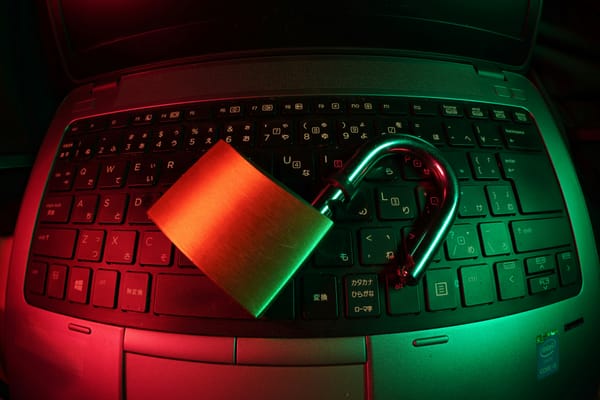 Big padlock placed on a laptop keyboard